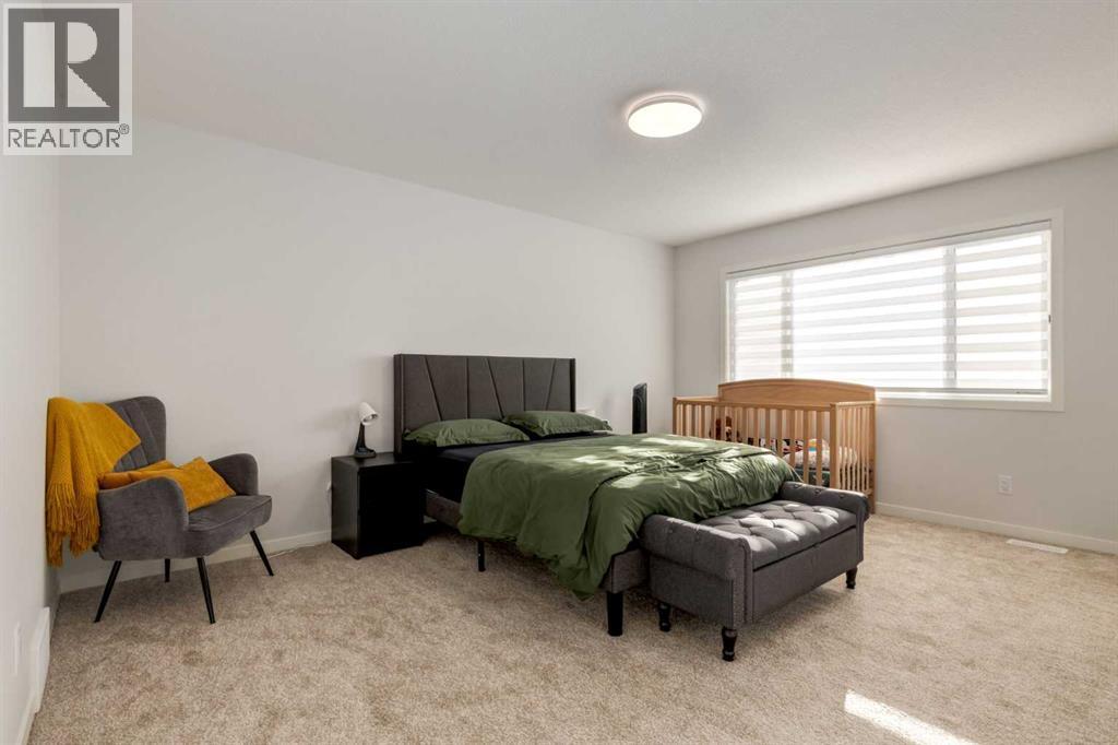 29 Marmot Passage Nw, Calgary, AB - Indoor Photo Showing Bedroom
