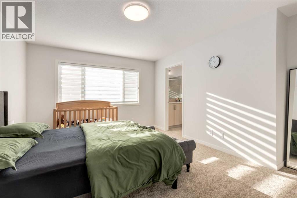 29 Marmot Passage Nw, Calgary, AB - Indoor Photo Showing Bedroom