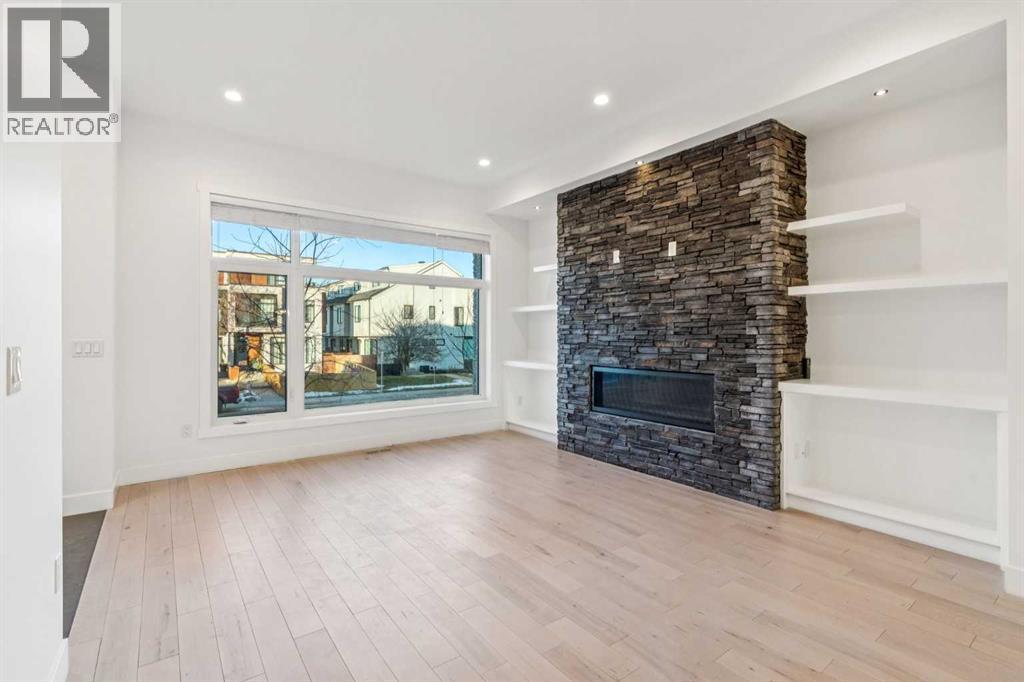 2409 28 Avenue Sw, Calgary, AB - Indoor Photo Showing Living Room With Fireplace