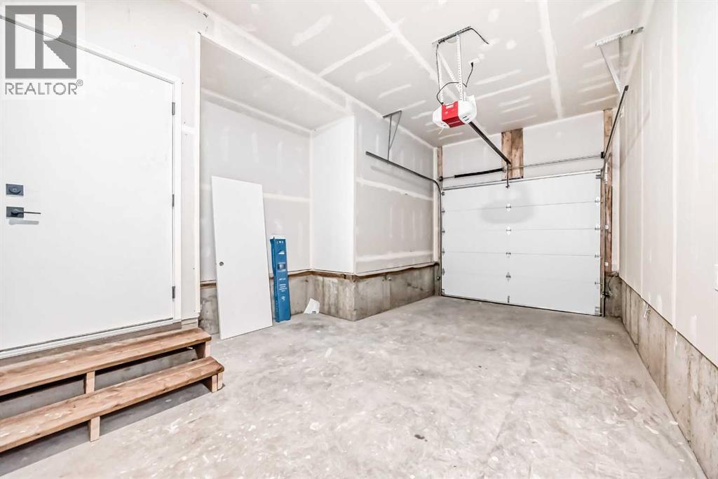 Garage - 8530 Bowness Road Nw, Calgary, AB - Indoor Photo Showing Garage