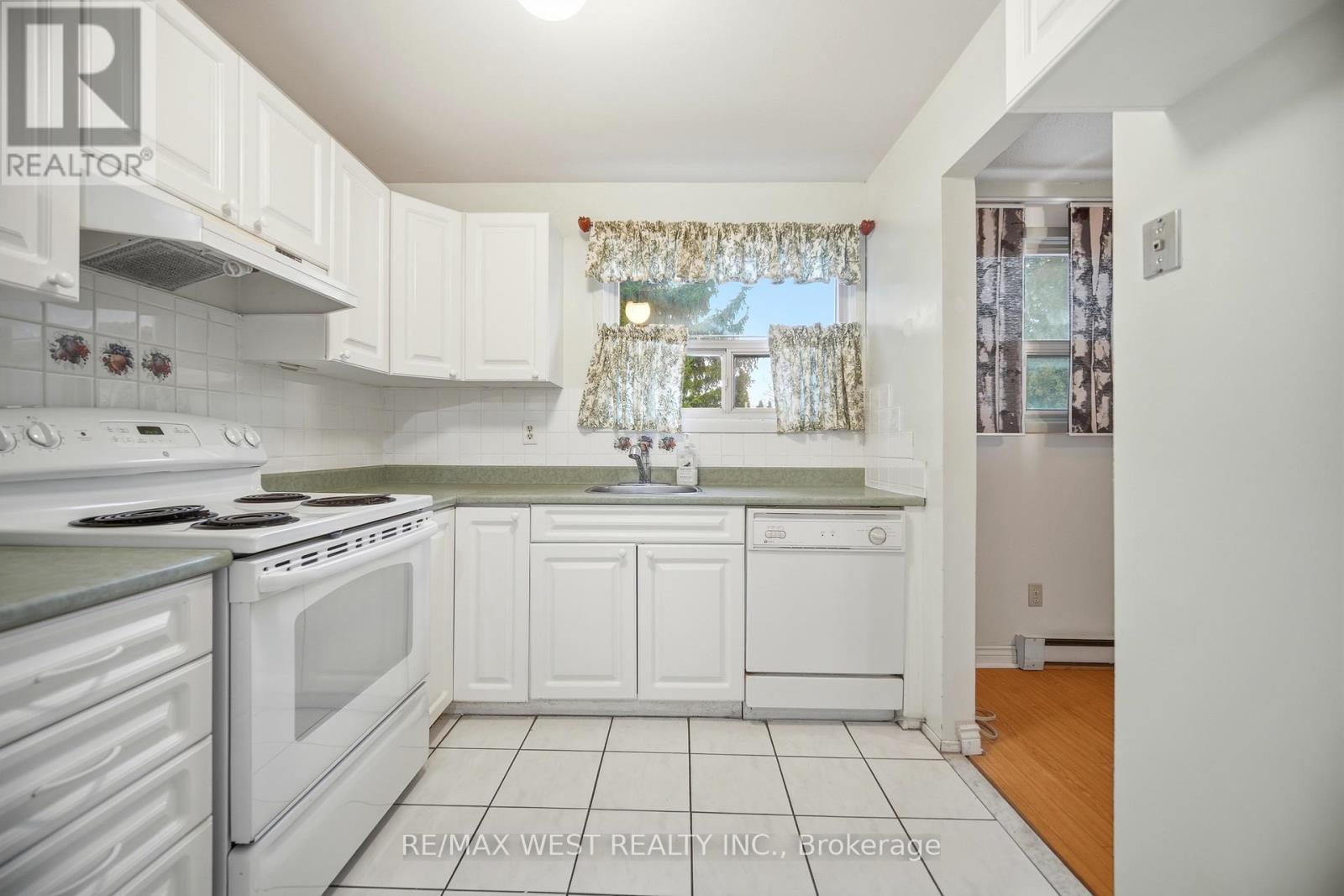 Large Window Overlooking Backyard - 6 Hillpark Trail, Brampton, ON - Indoor Photo Showing Kitchen