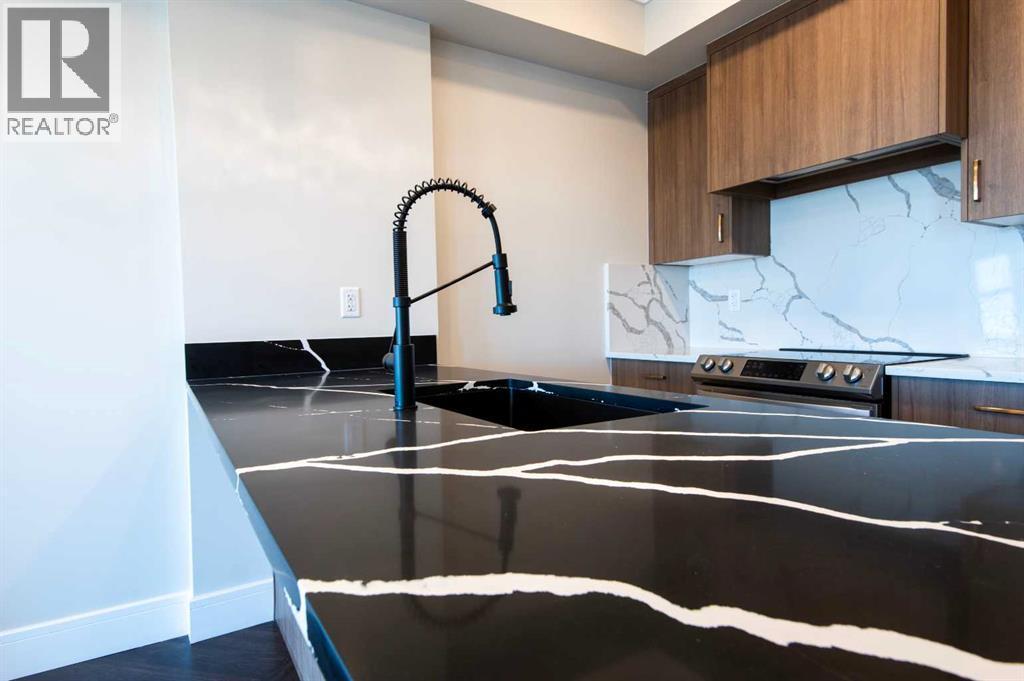 414, 370 Dieppe Drive Sw, Calgary, AB - Indoor Photo Showing Kitchen With Double Sink