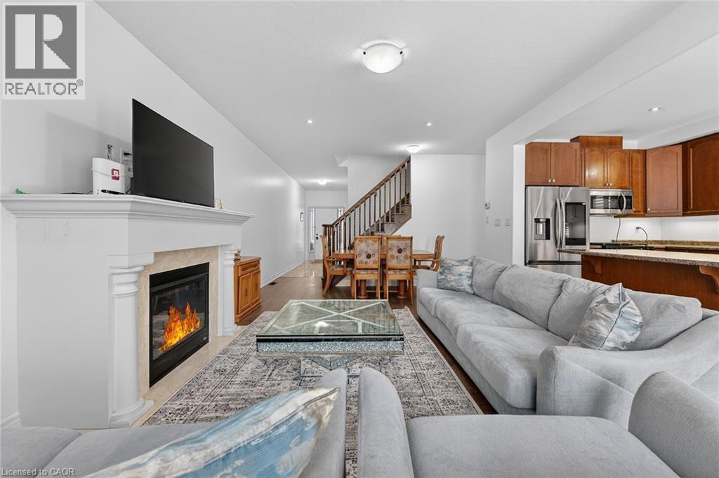 63 Chamomile Drive, Hamilton, ON - Indoor Photo Showing Living Room With Fireplace
