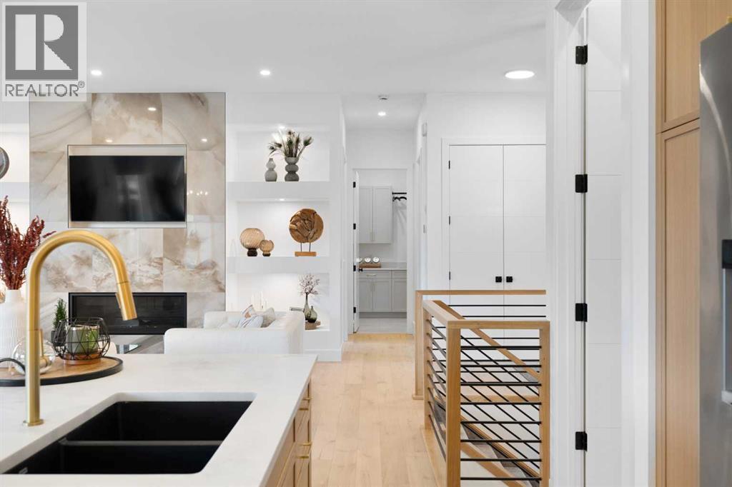 19 Monterra Way, Rural Rocky View County, AB - Indoor Photo Showing Kitchen With Double Sink