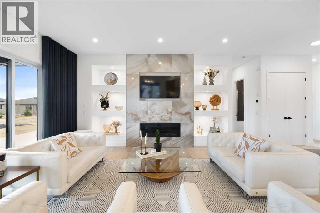 19 Monterra Way, Rural Rocky View County, AB - Indoor Photo Showing Living Room With Fireplace