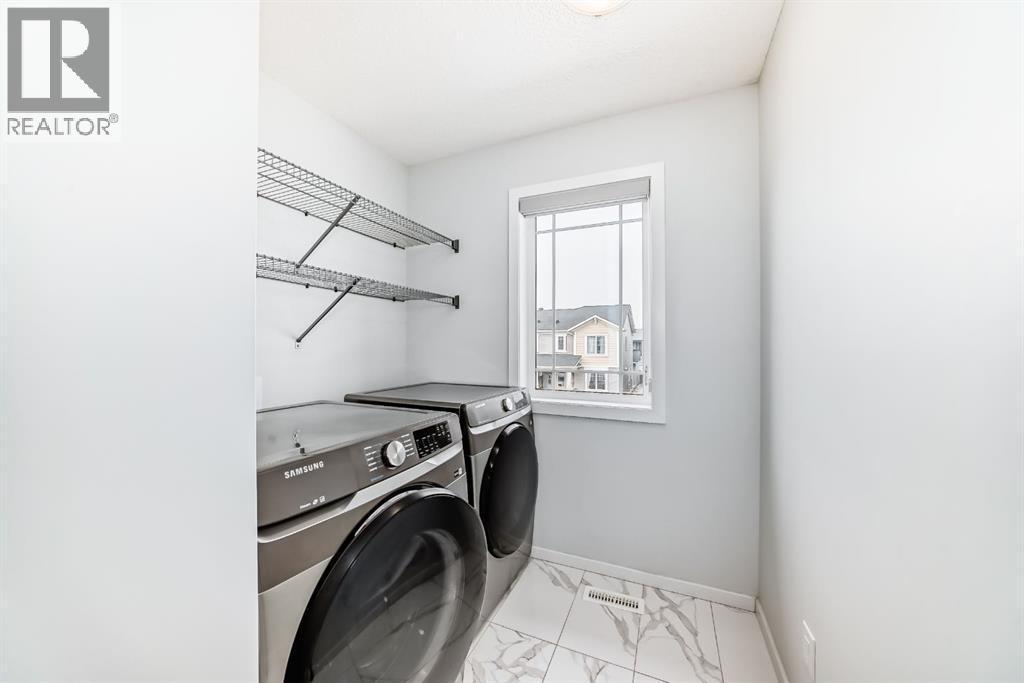 140 Carringham Road Nw, Calgary, AB - Indoor Photo Showing Laundry Room