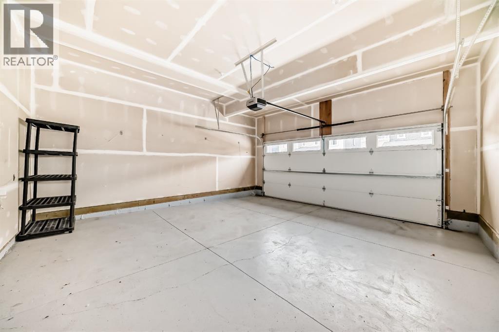 140 Carringham Road Nw, Calgary, AB - Indoor Photo Showing Garage