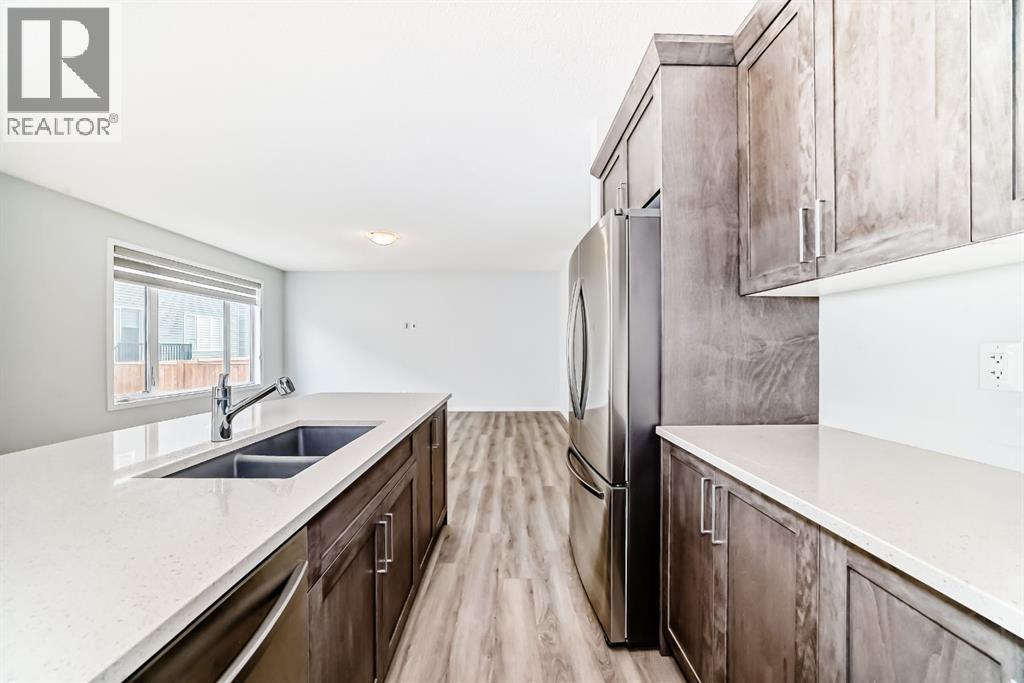 140 Carringham Road Nw, Calgary, AB - Indoor Photo Showing Kitchen With Double Sink