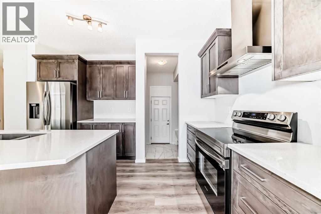 140 Carringham Road Nw, Calgary, AB - Indoor Photo Showing Kitchen With Double Sink With Upgraded Kitchen