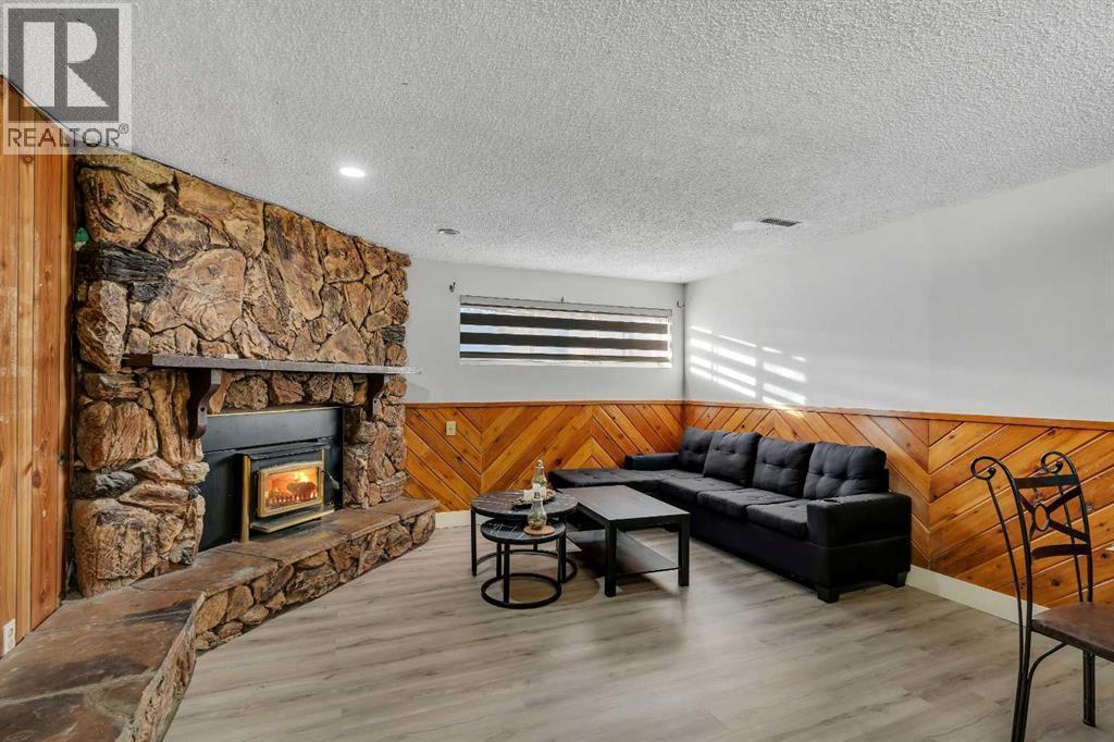 108 Whiteglen Crescent Ne, Calgary, AB - Indoor Photo Showing Living Room With Fireplace