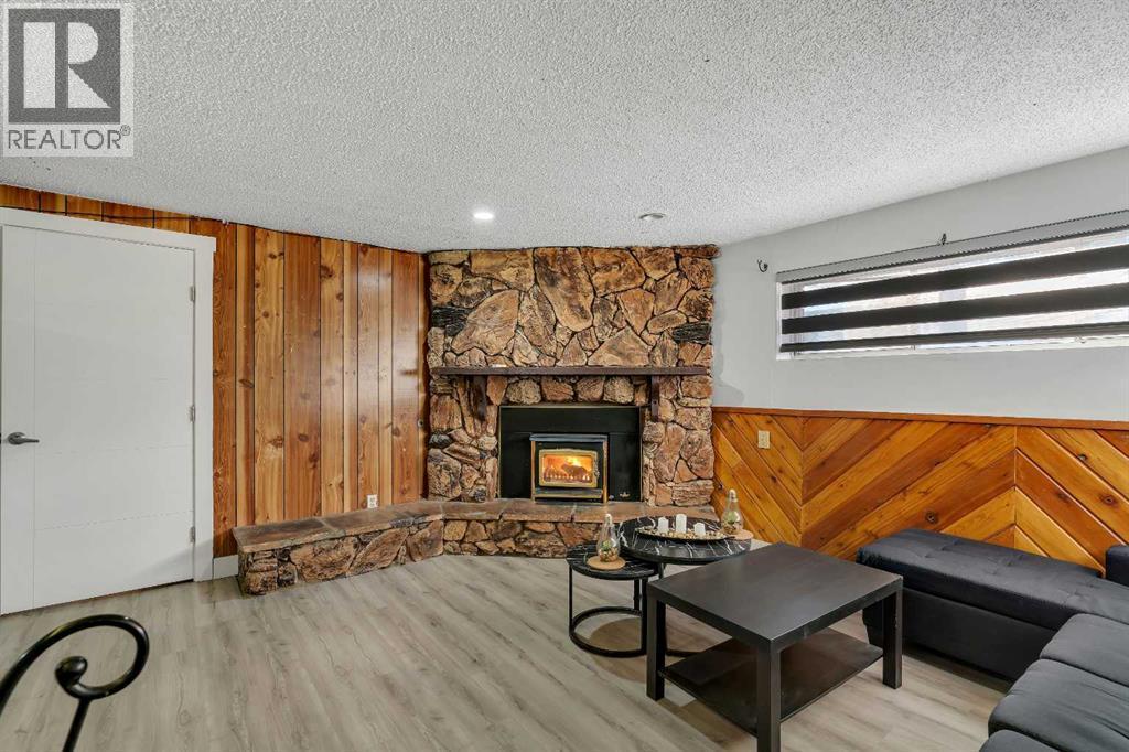 108 Whiteglen Crescent Ne, Calgary, AB - Indoor Photo Showing Living Room With Fireplace