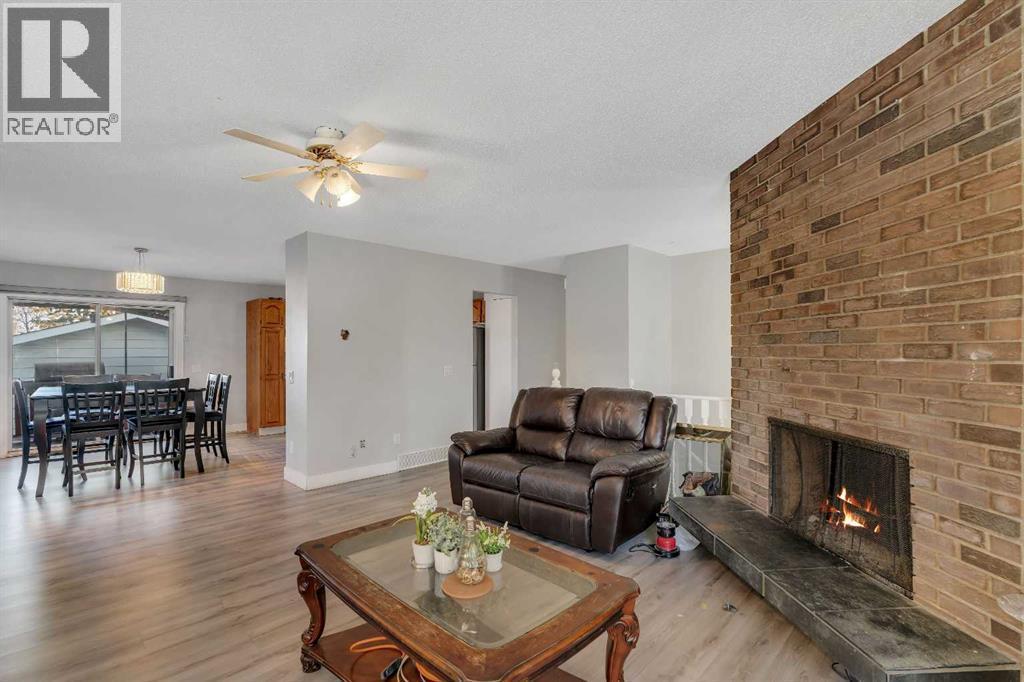 108 Whiteglen Crescent Ne, Calgary, AB - Indoor Photo Showing Living Room With Fireplace