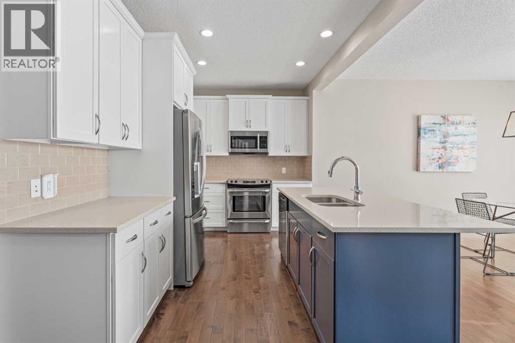Large pantry - 308 Chaparral Valley Way Se, Calgary, AB - Indoor Photo Showing Kitchen With Stainless Steel Kitchen With Double Sink With Upgraded Kitchen