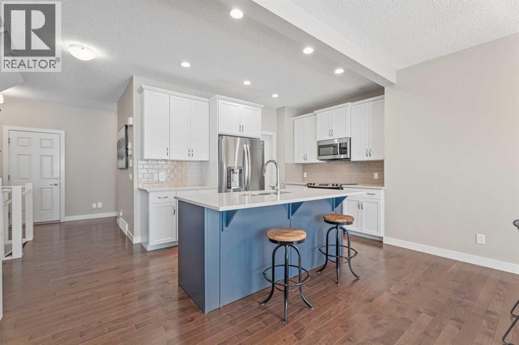 Hardwood floors - 308 Chaparral Valley Way Se, Calgary, AB - Indoor Photo Showing Kitchen With Upgraded Kitchen
