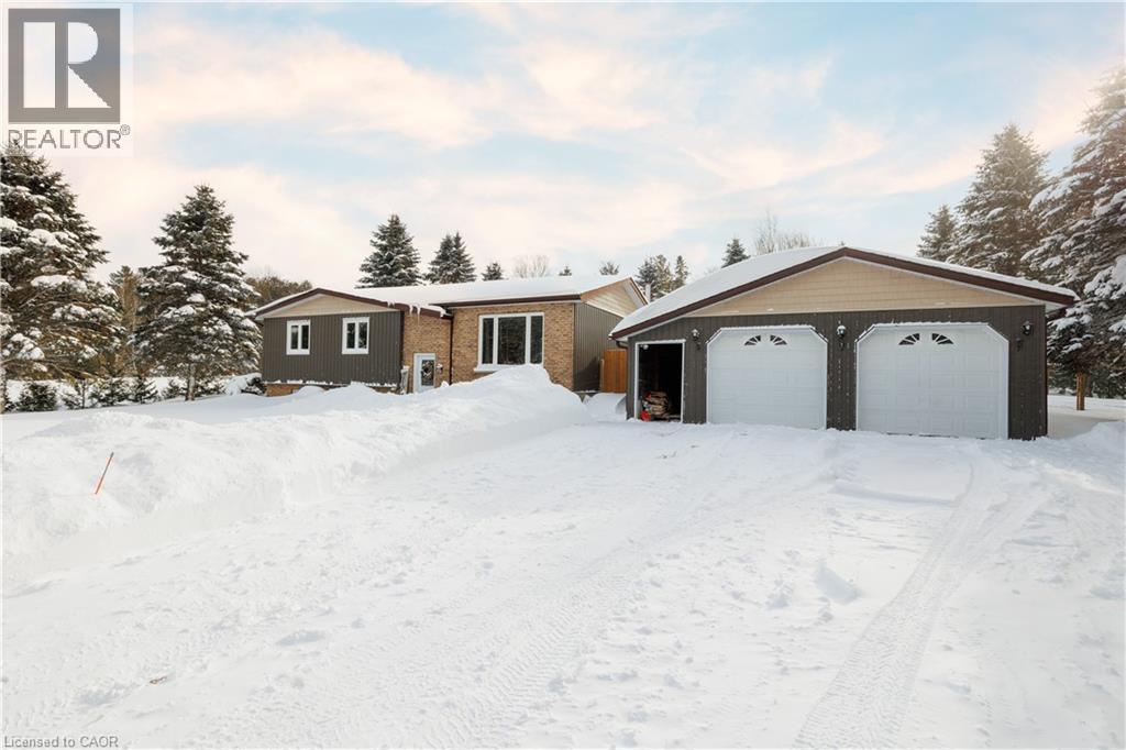Ranch-style house featuring an outdoor structure and a detached garage - 230 Saugeen Street, Grey Highlands, ON - Outdoor