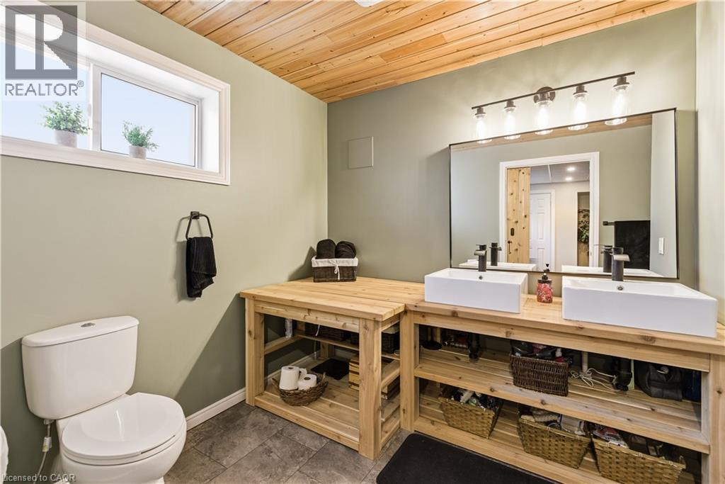 Full bath featuring double vanity and wood ceiling - 230 Saugeen Street, Grey Highlands, ON - Indoor Photo Showing Bathroom