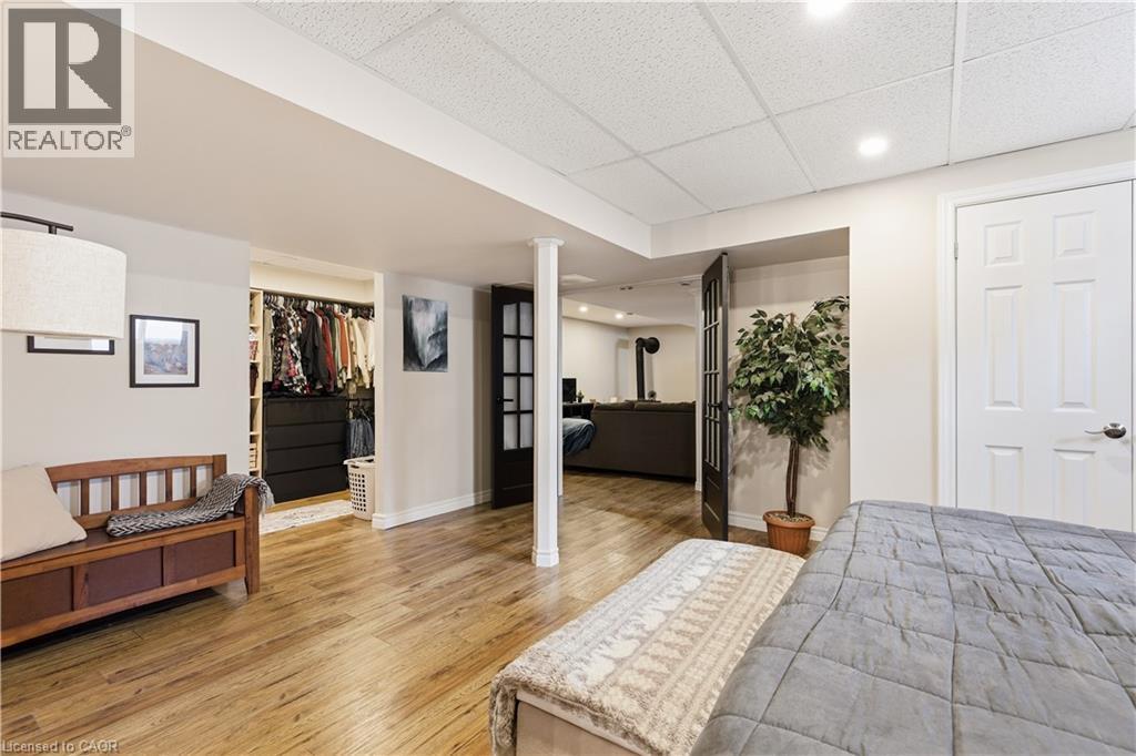 Bedroom with a drop ceiling, a walk in closet, light wood-style floors, and recessed lighting - 230 Saugeen Street, Grey Highlands, ON - Indoor