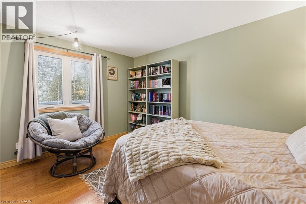 Bedroom featuring wood finished floors and baseboards - 230 Saugeen Street, Grey Highlands, ON - Indoor Photo Showing Bedroom