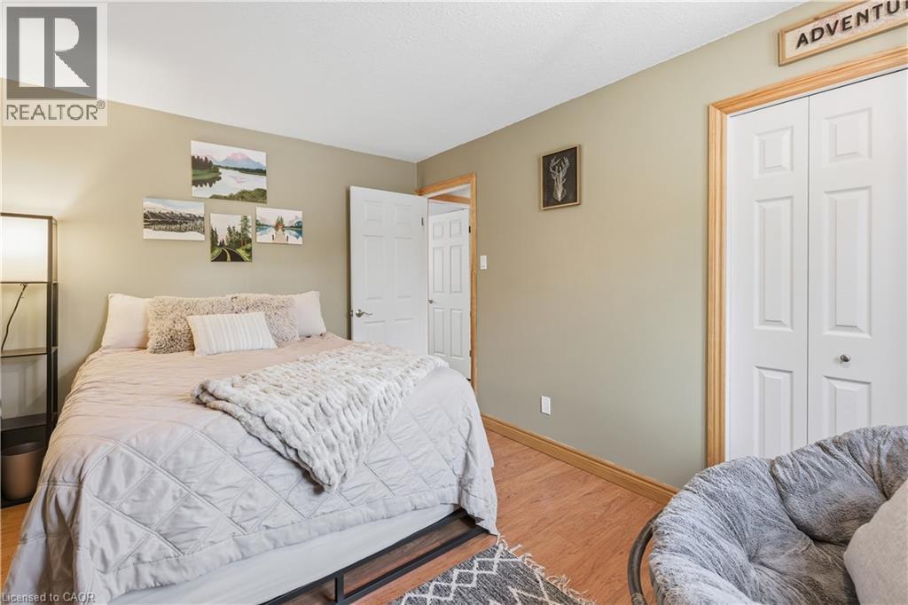 Bedroom featuring a closet and wood finished floors - 230 Saugeen Street, Grey Highlands, ON - Indoor Photo Showing Bedroom