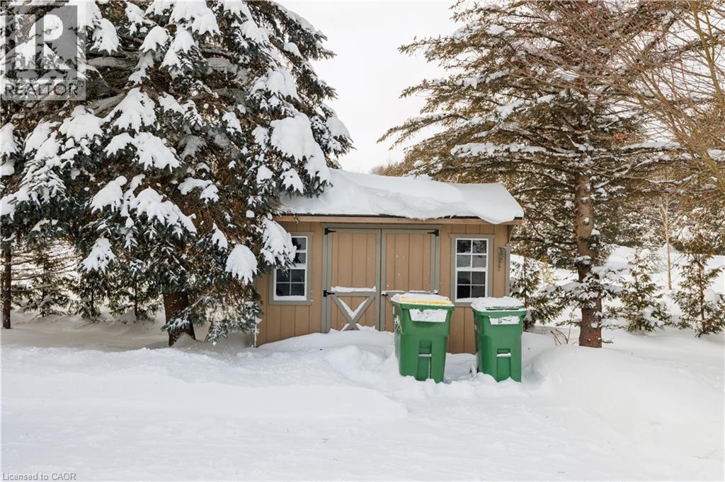 Snow covered structure featuring a shed - 230 Saugeen Street, Grey Highlands, ON - Outdoor