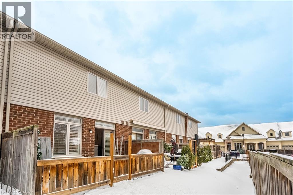 fully fenced patio - 5056 New Street Unit# 21, Burlington, ON - Outdoor With Deck Patio Veranda With Exterior