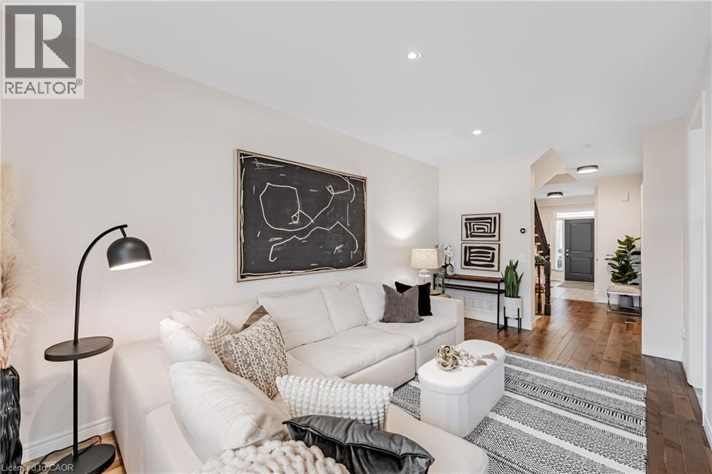 Living area featuring light wood finished floors and recessed lighting - 5056 New Street Unit# 21, Burlington, ON - Indoor Photo Showing Living Room
