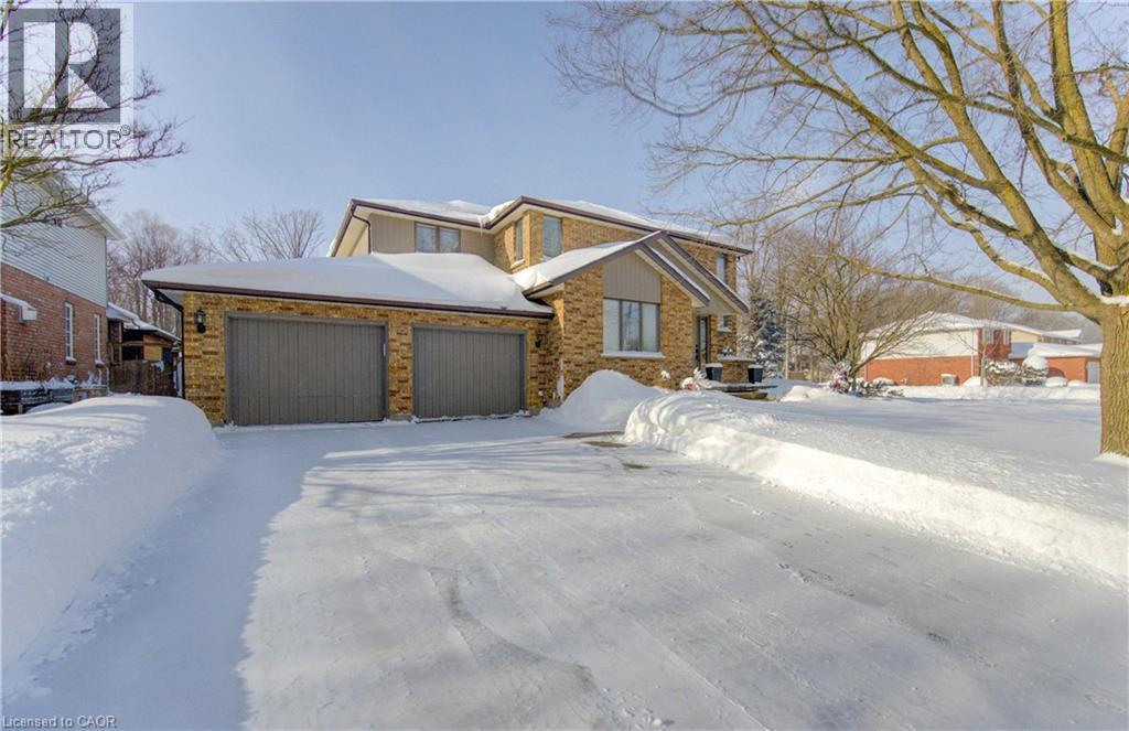 Parking for 2 inside and 4 more on the concrete driveway - 593 Guildwood Place, Waterloo, ON - Outdoor With Facade