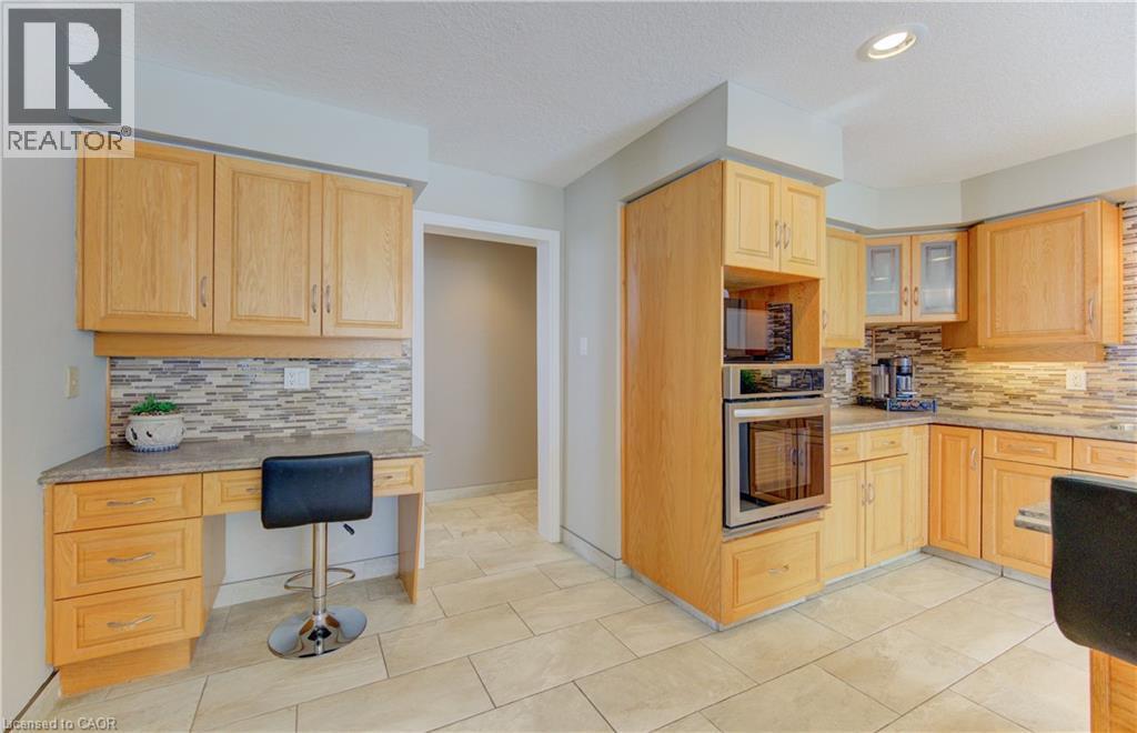 Built in oven and desk - 593 Guildwood Place, Waterloo, ON - Indoor Photo Showing Kitchen