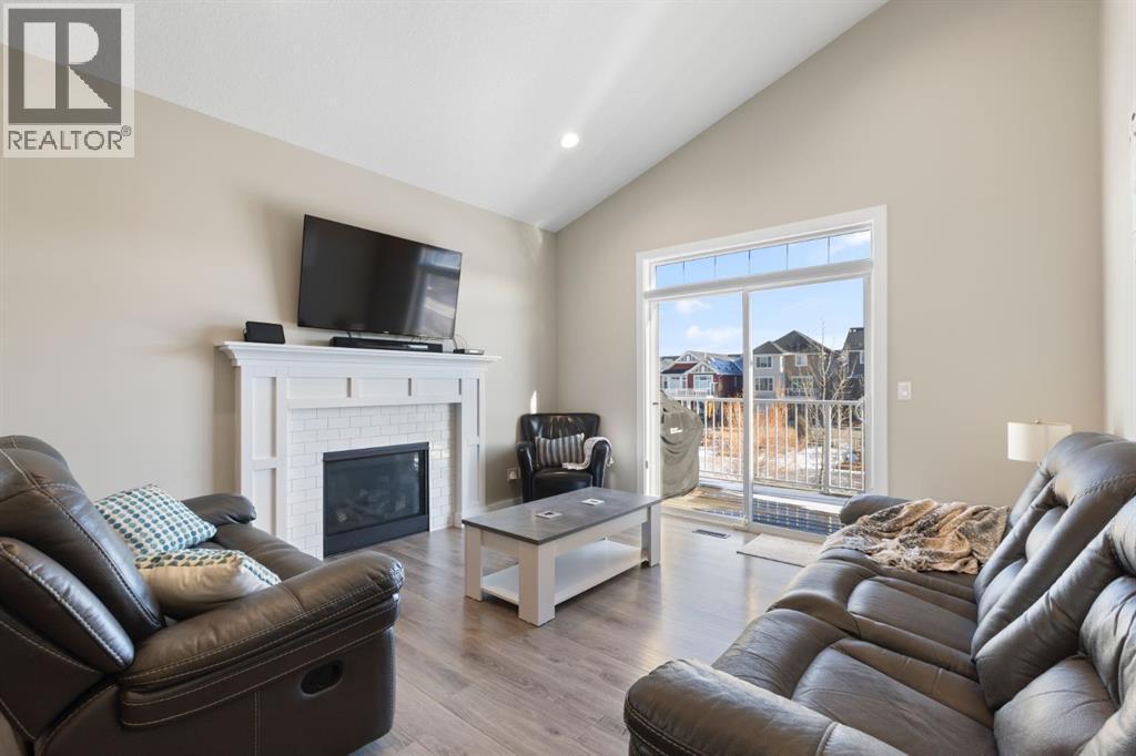 86 Bayview Circle Sw, Airdrie, AB - Indoor Photo Showing Living Room With Fireplace