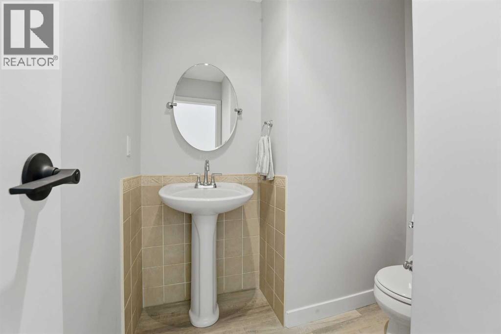 Main level 2 piece bathroom - 4 Pardue Close, Red Deer, AB - Indoor Photo Showing Bathroom