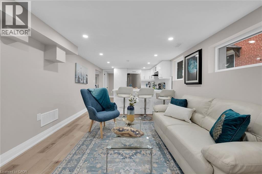 Living area with light wood-style floors and recessed lighting - 174 East 34Th Street, Hamilton, ON - Indoor Photo Showing Living Room