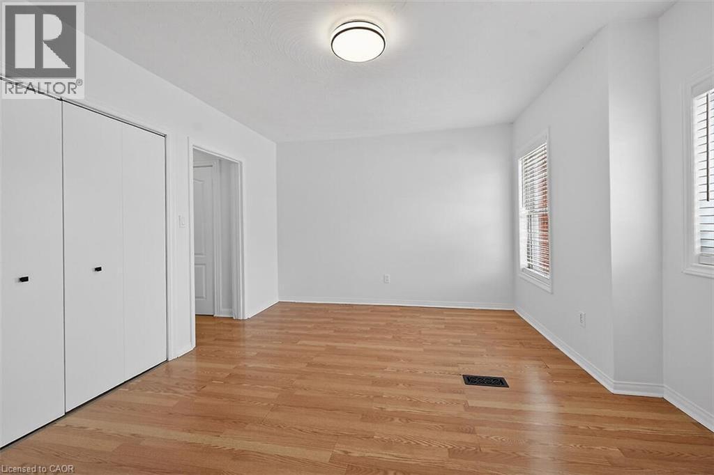 Living room with enclosed laundry - 77 Barton Street E Unit# 2, Hamilton, ON - Indoor Photo Showing Other Room