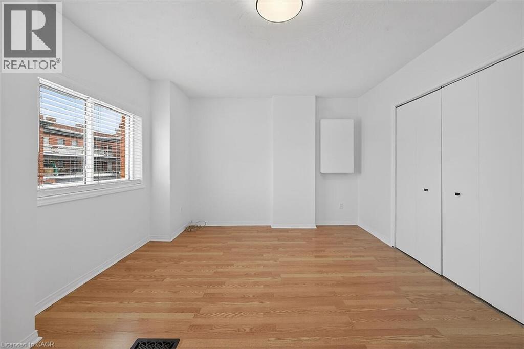 Livingroom with enclosed laundry. - 77 Barton Street E Unit# 2, Hamilton, ON - Indoor Photo Showing Other Room