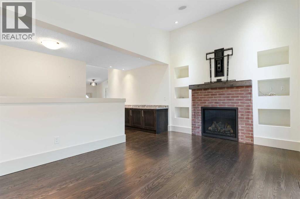 4711 Norquay Drive Nw, Calgary, AB - Indoor Photo Showing Living Room With Fireplace