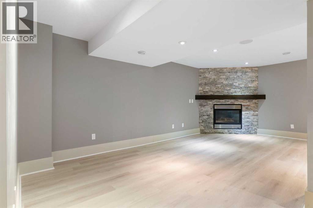 4711 Norquay Drive Nw, Calgary, AB - Indoor Photo Showing Living Room With Fireplace