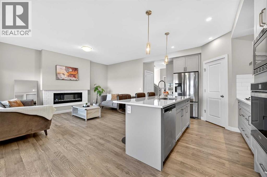 77 Belvedere Drive Se, Calgary, AB - Indoor Photo Showing Kitchen With Fireplace With Upgraded Kitchen
