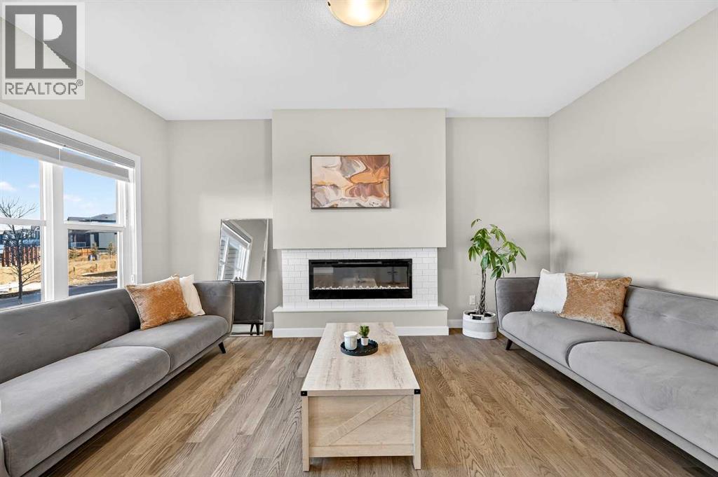 77 Belvedere Drive Se, Calgary, AB - Indoor Photo Showing Living Room With Fireplace