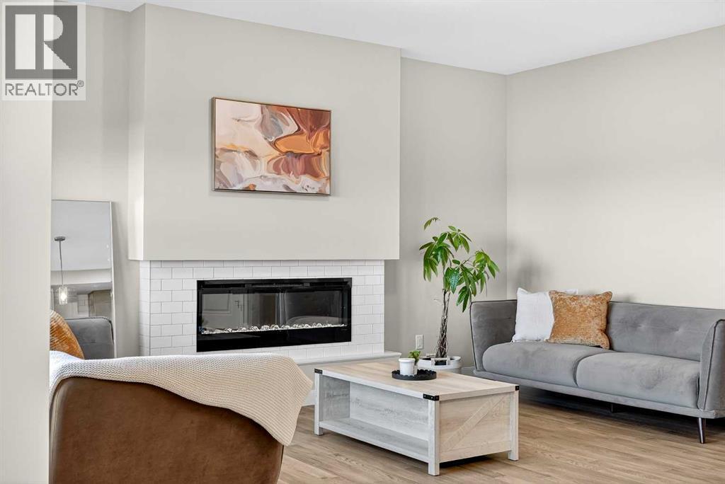 77 Belvedere Drive Se, Calgary, AB - Indoor Photo Showing Living Room With Fireplace