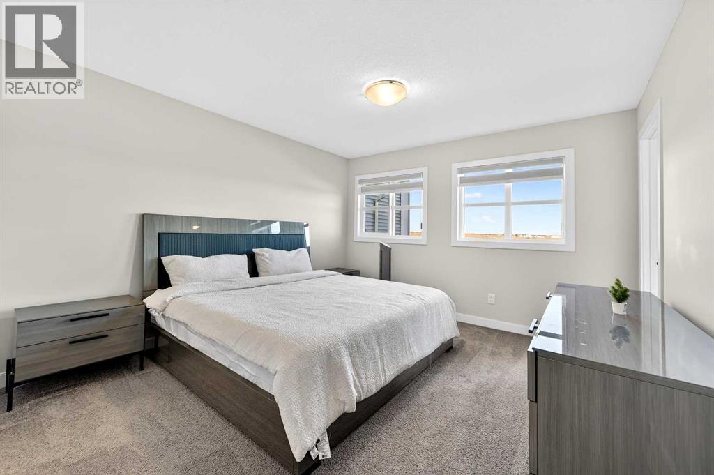 77 Belvedere Drive Se, Calgary, AB - Indoor Photo Showing Bedroom