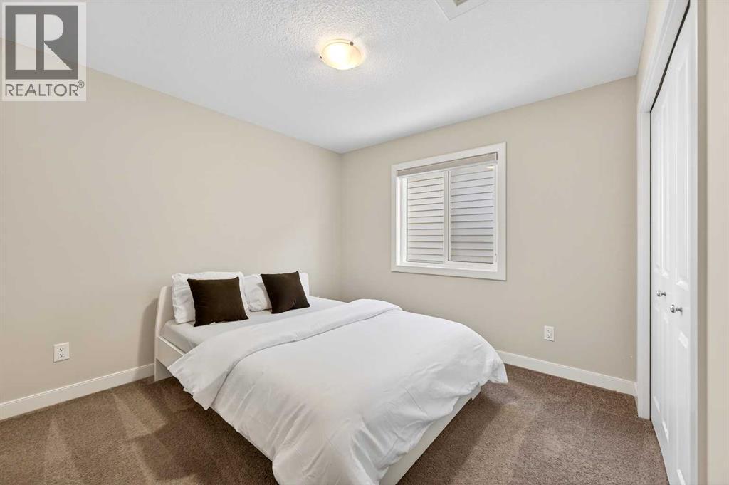 77 Belvedere Drive Se, Calgary, AB - Indoor Photo Showing Bedroom