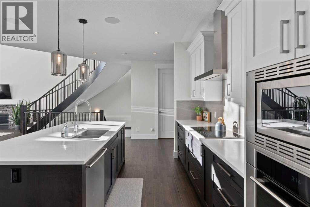 67 Aspen Vista Way Sw, Calgary, AB - Indoor Photo Showing Kitchen With Double Sink With Upgraded Kitchen
