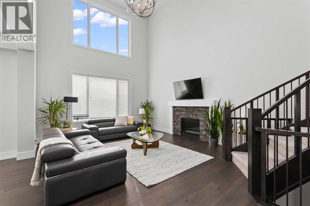 67 Aspen Vista Way Sw, Calgary, AB - Indoor Photo Showing Living Room With Fireplace