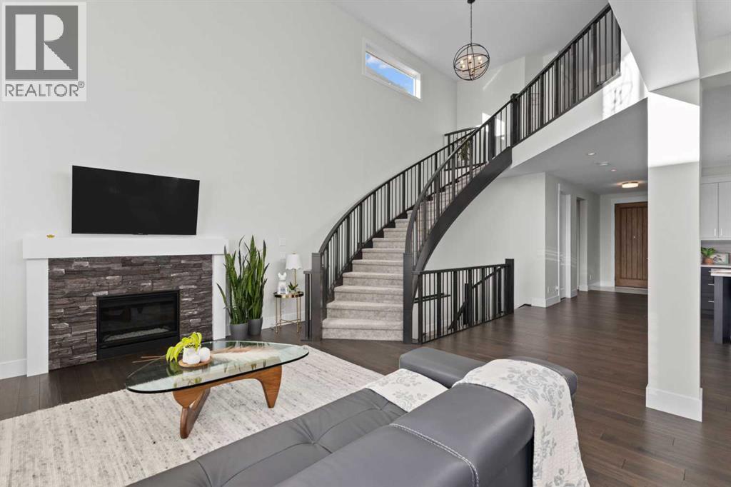 67 Aspen Vista Way Sw, Calgary, AB - Indoor Photo Showing Living Room With Fireplace