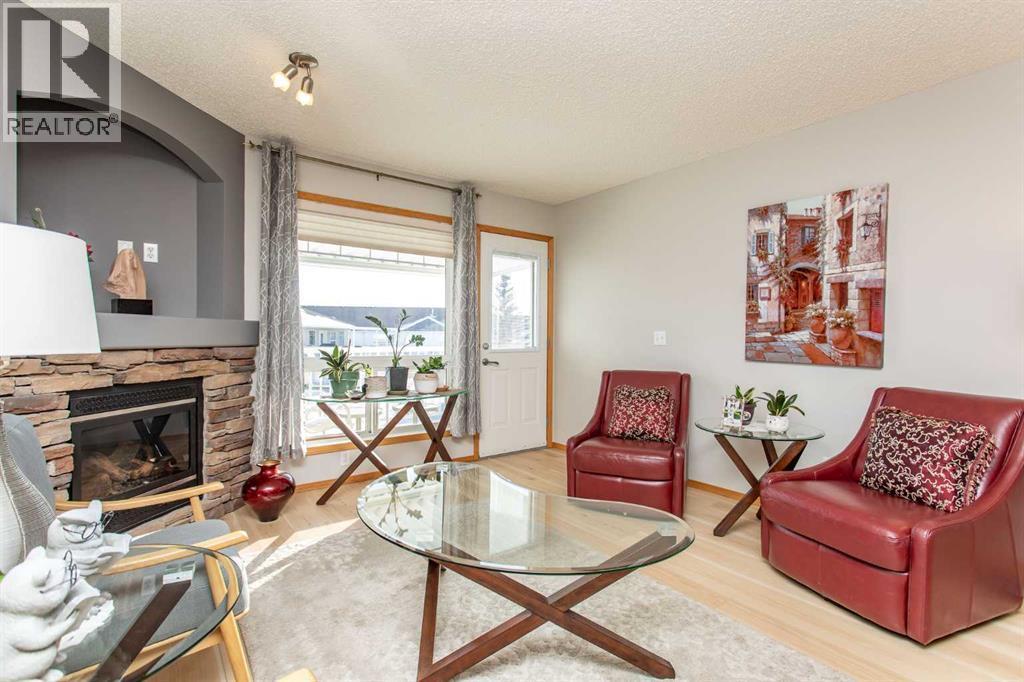 409 Jenkins Drive, Red Deer, AB - Indoor Photo Showing Living Room With Fireplace