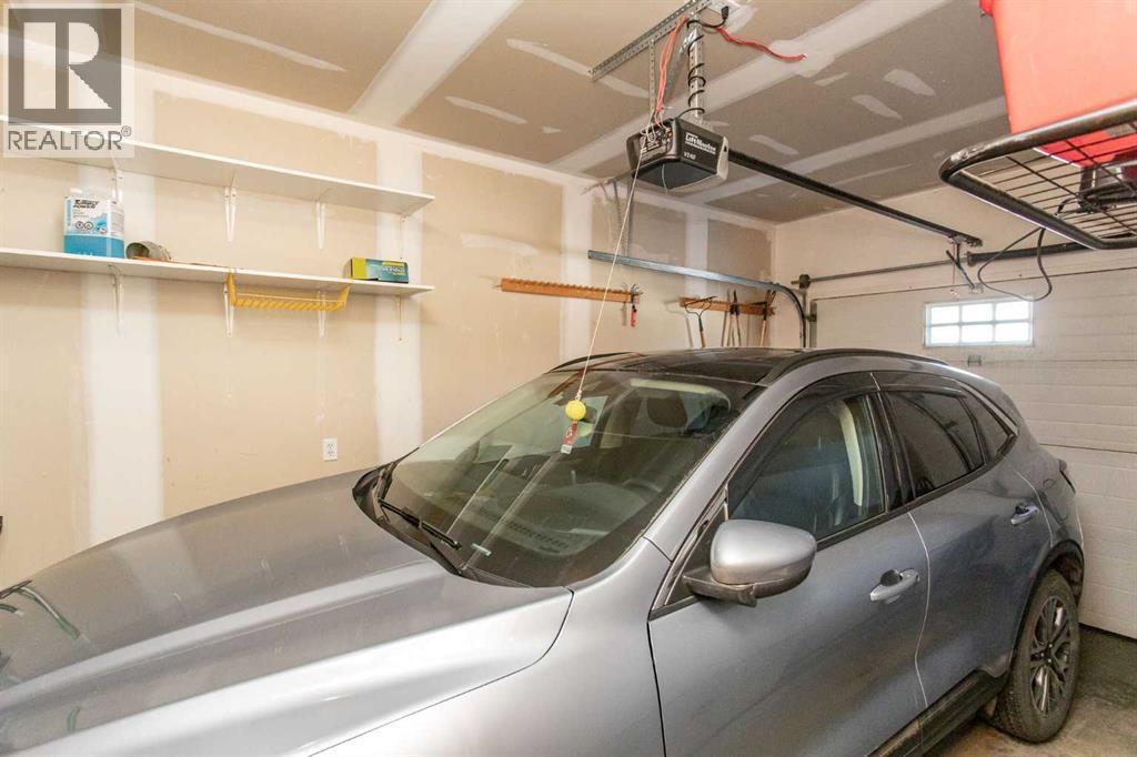 409 Jenkins Drive, Red Deer, AB - Indoor Photo Showing Garage