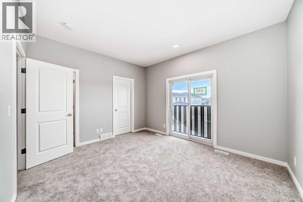 PLEASE NOTE: Photos are of a DIFFERENT Spec Home of the same model – fit and finish may differ. Interior selections and floorplans shown in photos - 85 Starling Boulevard Nw, Calgary, AB - Indoor Photo Showing Other Room