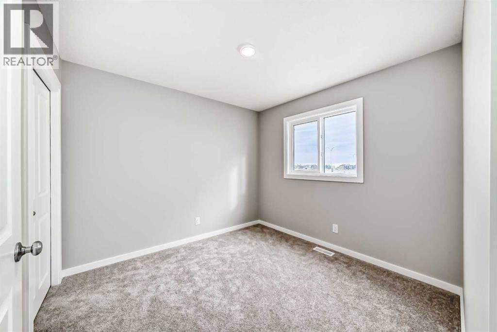 PLEASE NOTE: Photos are of a DIFFERENT Spec Home of the same model – fit and finish may differ. Interior selections and floorplans shown in photos - 85 Starling Boulevard Nw, Calgary, AB - Indoor Photo Showing Other Room