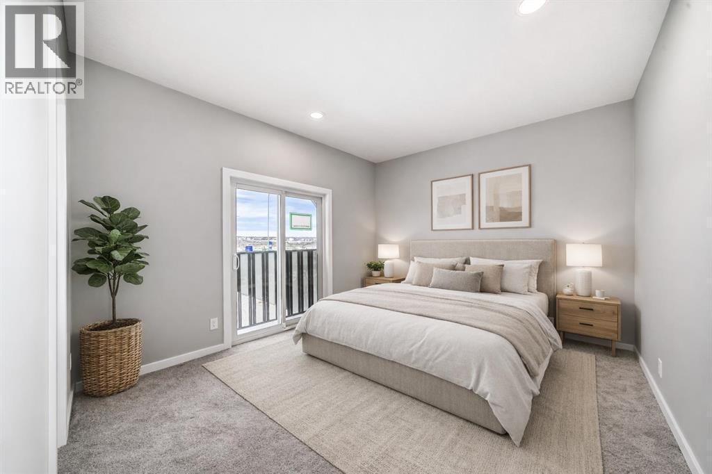 VIRTUALLY STAGED • PLEASE NOTE: Photos are of a DIFFERENT Spec Home of the same model – fit and finish may differ. Interior selections and floorplans shown in photos - 85 Starling Boulevard Nw, Calgary, AB - Indoor Photo Showing Bedroom