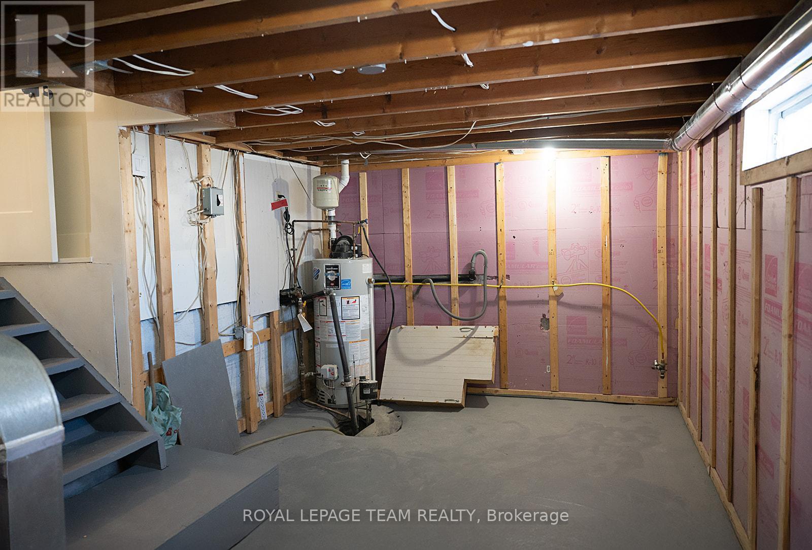 Bsmt w/ water heater, sump pump, gas dryer hook-up - 405 Barnes Street, North Grenville, ON - Indoor Photo Showing Basement