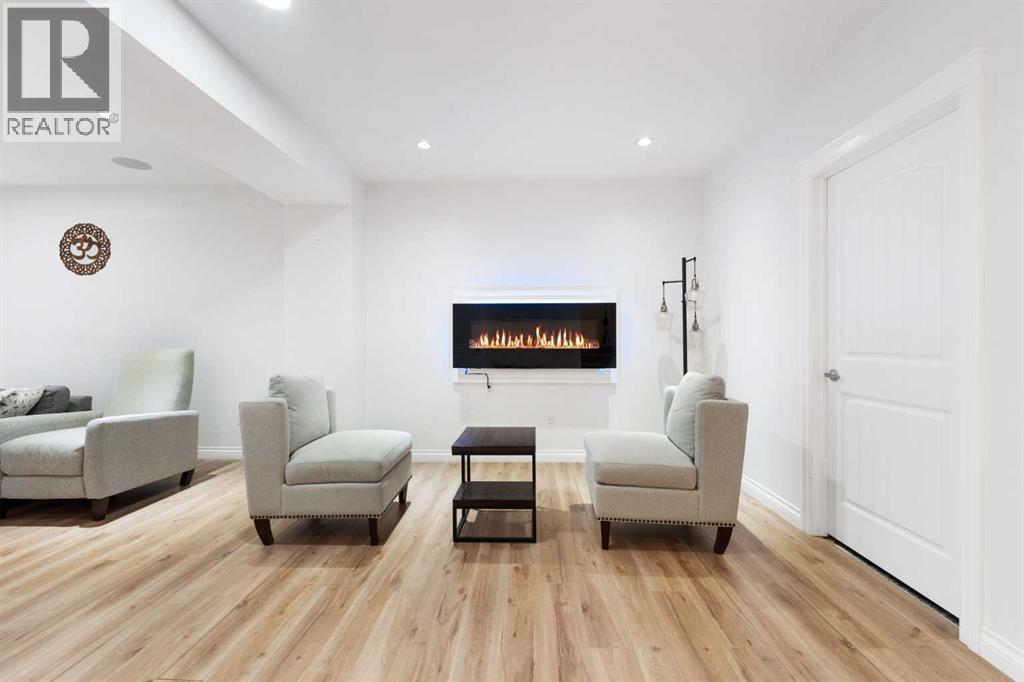 99 Evansglen Circle Nw, Calgary, AB - Indoor Photo Showing Other Room With Fireplace